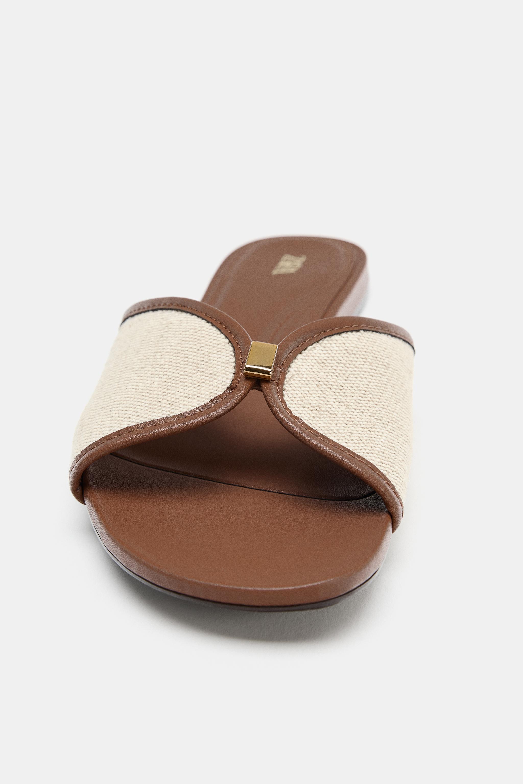 FLAT SANDALS WITH METAL DETAIL